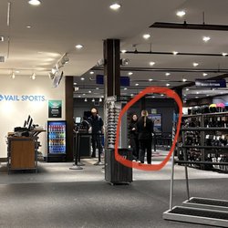 Vail Sports - Vail Mountain Plaza - The two female staff members who chatted and played on their phone while customers were in line