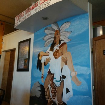 Tortas Chilangas - a mural of a man carrying a woman - Mexican Near Me - Sacramento, California Tortas Chilangas - a mural of a man carrying a woman - Mexican Near Me - Sacramento, California