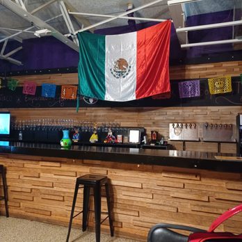 La Victoria - a bar with a mexican flag hanging from the ceiling - Mexican Near Me - Troy, New York