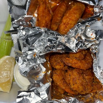 Three Dollar Cafe - a tray of chicken wings and a pickle - American Near Me - Sandy Springs, Georgia Three Dollar Cafe - a tray of chicken wings and a pickle - American Near Me - Sandy Springs, Georgia