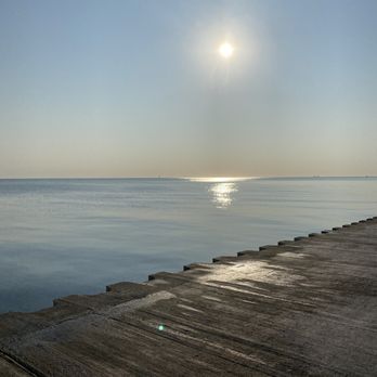 Recreation Drive - Sun glistening off the smooth water.  Very little current or wind - Lakes Near Me - Chicago, Illinois
