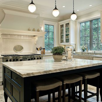 Coastline Property Services Construction & Remodeling - a kitchen with a large island - General Contractors Near Me Coastline Property Services Construction & Remodeling - a kitchen with a large island - General Contractors Near Me