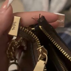 Coach - Broken zipper within just a month. Great service to exchange at G mall location :)