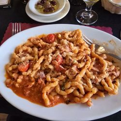 Dicor Italian & Argentinian Restaurant - Fussili Alla Matriciana - Homemade Fussili sautéed with Pancetta in a light tomato sauce.