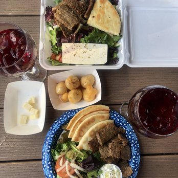 Santorini Cafe - Lamb plate and Lamb salad with side of beignets sangria comes paired with cheese - Greek Near Me - Austin, Texas