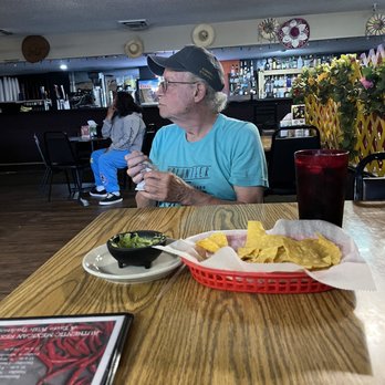El DOS De Oros - a man sitting at a table eating - Mexican Near Me - Scott City, Kansas El DOS De Oros - a man sitting at a table eating - Mexican Near Me - Scott City, Kansas