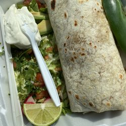 Taqueria El Tapatillo - Carne Asada burrito. The only complaint is that all of those toppings we're on the outside instead of the inside!??!