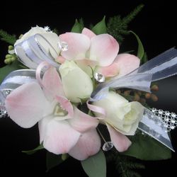 Wyckoff Florist & Gifts - Dendrobium and Spray rose Wristlet.  Can be customized to your taste.