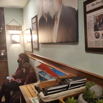 Limani Seafood Grill - two people sitting on a bench - Seafood Near Me - Westfield, New Jersey