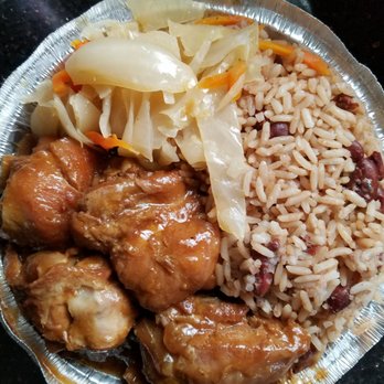 Jamaican Flavors - a plate of rice, meat, and vegetables - Bakeries Near Me - Jamaica, New York Jamaican Flavors - a plate of rice, meat, and vegetables - Bakeries Near Me - Jamaica, New York