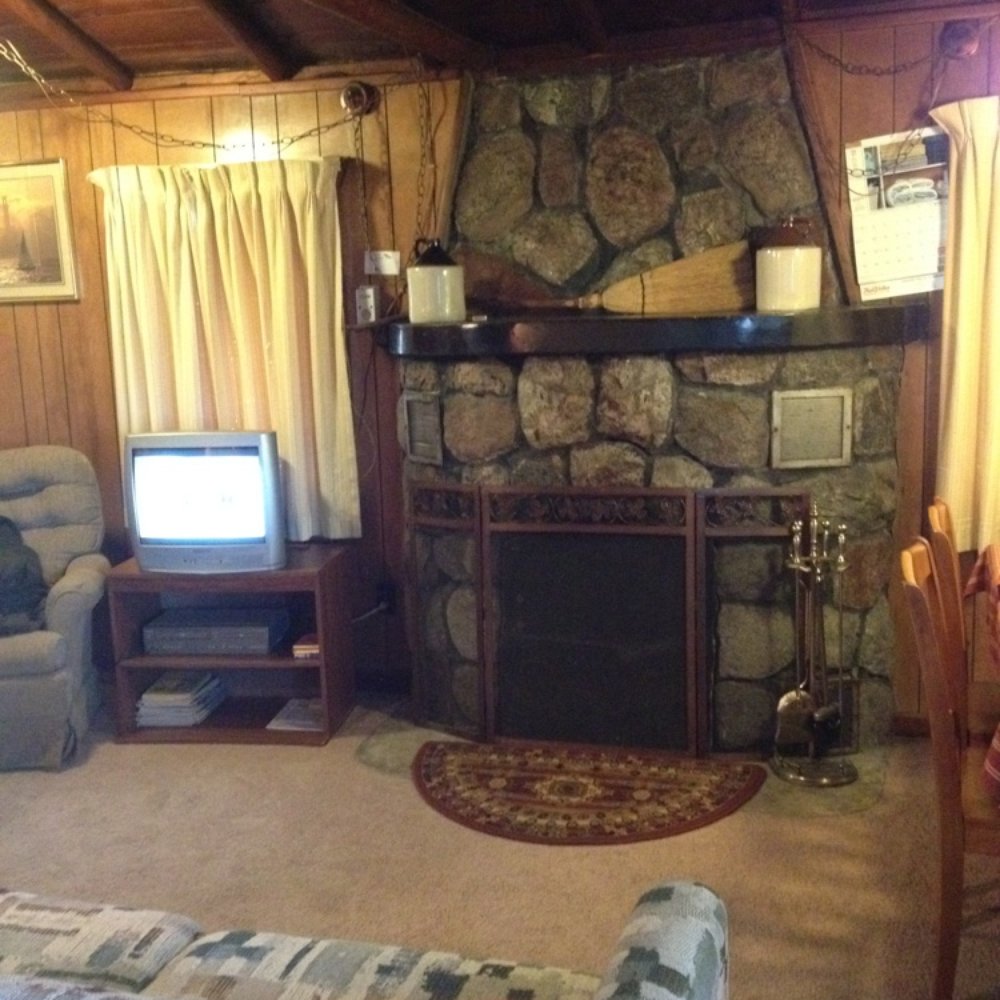 Birchwood Lodges - Living room with fireplace - Hotels Near Me - Paradise, Michigan Birchwood Lodges - Living room with fireplace - Hotels Near Me - Paradise, Michigan