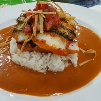 Chichen Itza Restaurant - Tikin xic.  Smoked white fish on a bed of rice with a achiote lime sauce - Mexican Near Me - Los Angeles, California