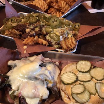 The Jackalope - Mushroom burger and their loaded waffle fries. Those pickles and jalapeños tho - Dive Bars Near Me - Austin, Texas