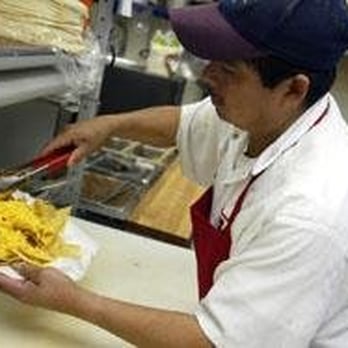 D'Leon's Mexican Food - a man preparing food - Mexican Near Me - Lincoln, Nebraska D'Leon's Mexican Food - a man preparing food - Mexican Near Me - Lincoln, Nebraska