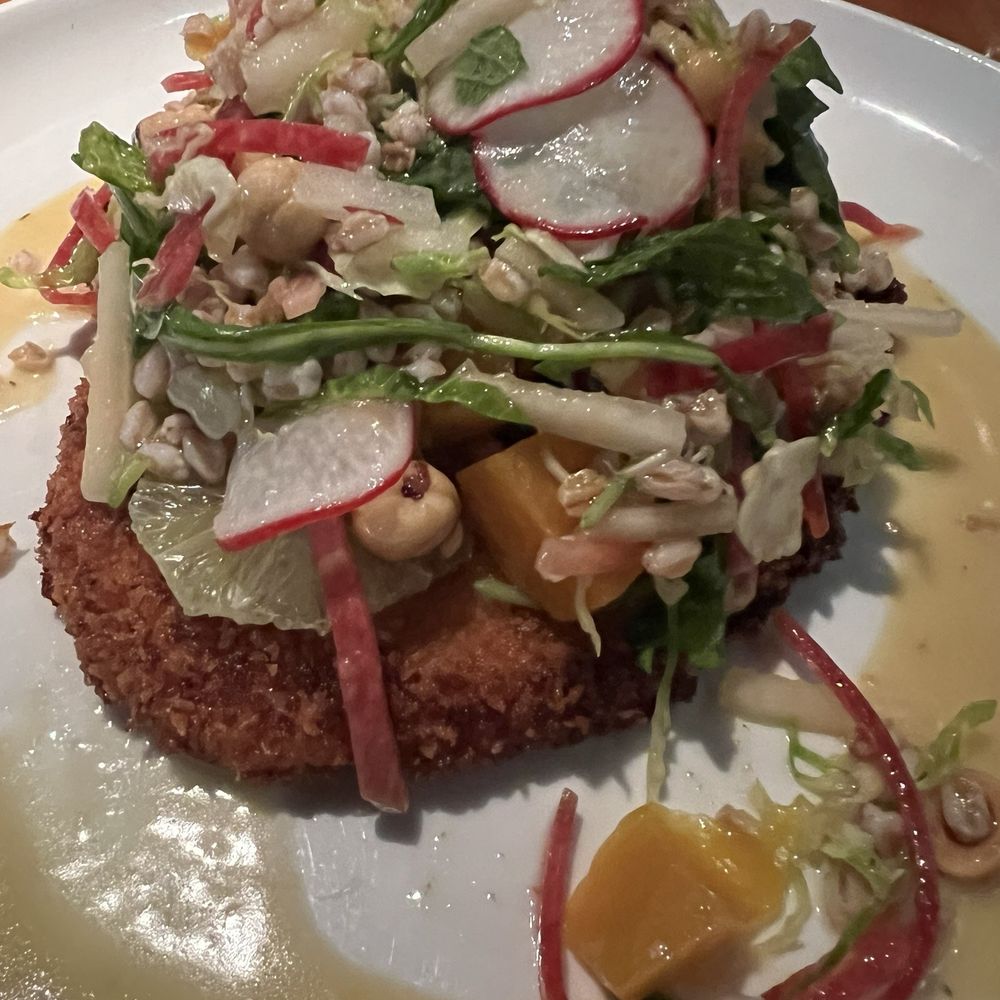 River Oaks Restaurant - Chicken entree with beet salad atop. - New American Near Me - Memphis, Tennessee