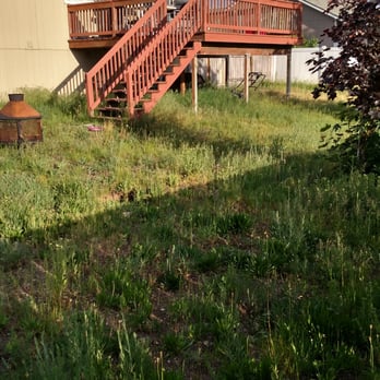 Resort Property Management - The yard in shambles.... Notice two mowers under the deck! WTF - Property Management Near Me - Coeur D Alene, Idaho Resort Property Management - The yard in shambles.... Notice two mowers under the deck! WTF - Property Management Near Me - Coeur D Alene, Idaho