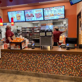 Popeyes Louisiana Kitchen - two people working in a restaurant - Fast Food Near Me - Austin, Texas Popeyes Louisiana Kitchen - two people working in a restaurant - Fast Food Near Me - Austin, Texas