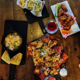 a wooden table with a variety of food items a wooden table with a variety of food items