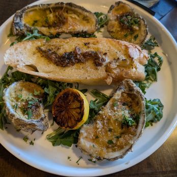 The Southern Table - Two pair of wood fired oysters on happy hour. $2 each pair. - Southern Near Me - Athens, Alabama