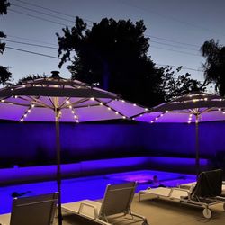 Athlon Pool Company - Night time view with LED lights in pool and spa