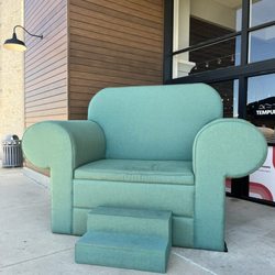 Couch Potatoes Furniture Store - North Austin - Giant chair for photo ops