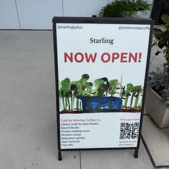 Monday Coffee - Entrance - A sidewalk sign displays the opening of Starling café, featuring a watercolor illustration and listing amenities like free Wi-Fi and outdoor seating. - Coffee & Tea Near Me - Chicago, Illinois