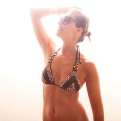 Bronze  Glow  Spray  Tan - A customer enjoying her pre beach glow ...her tan lines were evened out with our aloe based solution .