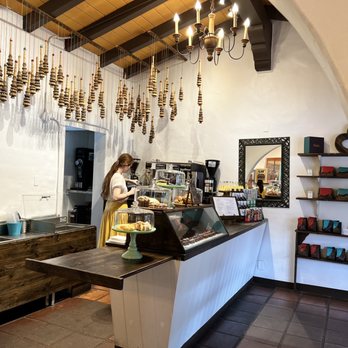 Nibble Chocolate - a woman standing behind a counter - Chocolatiers & Shops Near Me - San Diego, California
