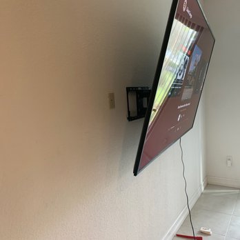 Rapid Handy - Mounted my tv in concrete and even hung from the frame to show how sturdy it was - Handyman Near Me
