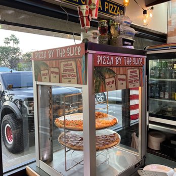 California Pizza Place - pizzas in a display case - Pizza Near Me - Anaheim, California California Pizza Place - pizzas in a display case - Pizza Near Me - Anaheim, California