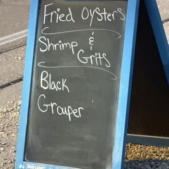 Blue Dog Bar & Grill - Outdoor blackboard - Bars Near Me - Matlacha, Florida