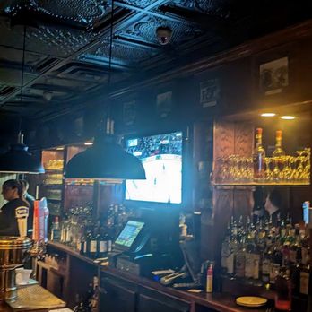West Shore Inn Steakhouse - a bar with a television - Steakhouses Near Me - Staten Island, New York
