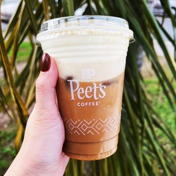 Peet's Coffee - a hand holding a cup of coffee - Coffee & Tea Near Me - Sacramento, California