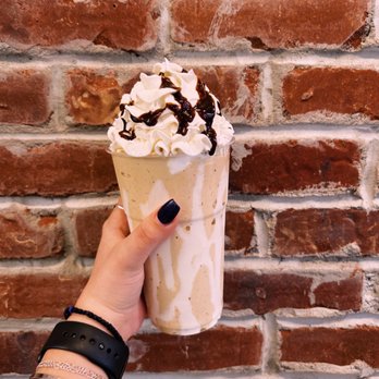 Campus Creamery - a hand holding a cup of ice cream - Ice Cream & Frozen Yogurt Near Me - Durham, New Hampshire