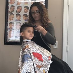 U-next Barbershop - A kid getting a nice haircut.  Love this place