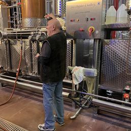 The owner explaining the distilling process The owner explaining the distilling process