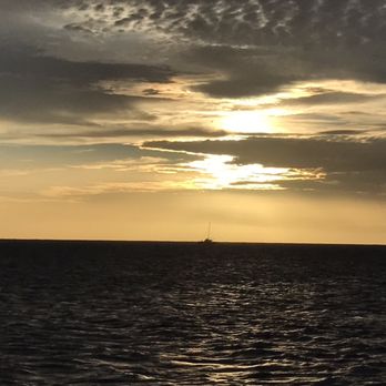 Blue Dolphin Charters - Sunset from the boat across na pali coast - Boating Near Me - Eleele, Hawaii