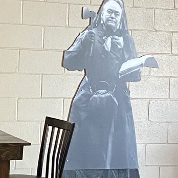 Broken Hatchet Brewery - a woman holding a book - Breweries Near Me - Belton, Missouri Broken Hatchet Brewery - a woman holding a book - Breweries Near Me - Belton, Missouri