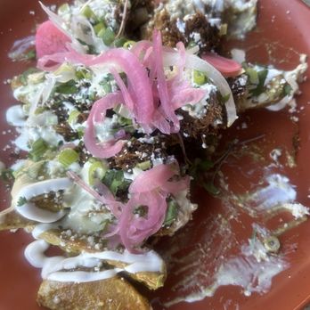 Bibisol - Loaded Poblano wedges with barbacoa (partially eaten) - Mexican Near Me - Sioux Falls, South Dakota