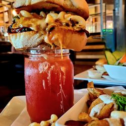 Cilantro And Chive - Gooey, spicy, yummy pulled pork caesar (with dill pickle poutine)