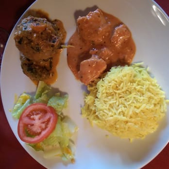 Jolly's Indian Bistro - Half of the chicken in the butter chicken dish, one of the two malai kofta dumplings, with the gross saffron rice and salad - Indian Near Me - Vancouver, British Columbia
