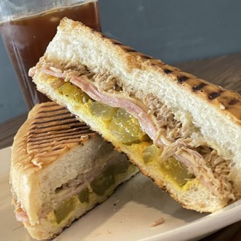 Young Hustler Coffee - A cubano sandwhich and an iced Americano; the Cuban experience. - Coffee & Tea Near Me - Richmond, Texas Young Hustler Coffee - A cubano sandwhich and an iced Americano; the Cuban experience. - Coffee & Tea Near Me - Richmond, Texas