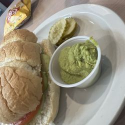 Veggie on white sub roll. Added side of avocado.