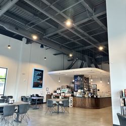Knowledge Perk - Main cafe space - board game area to the right and more tables & bathroom in the back
