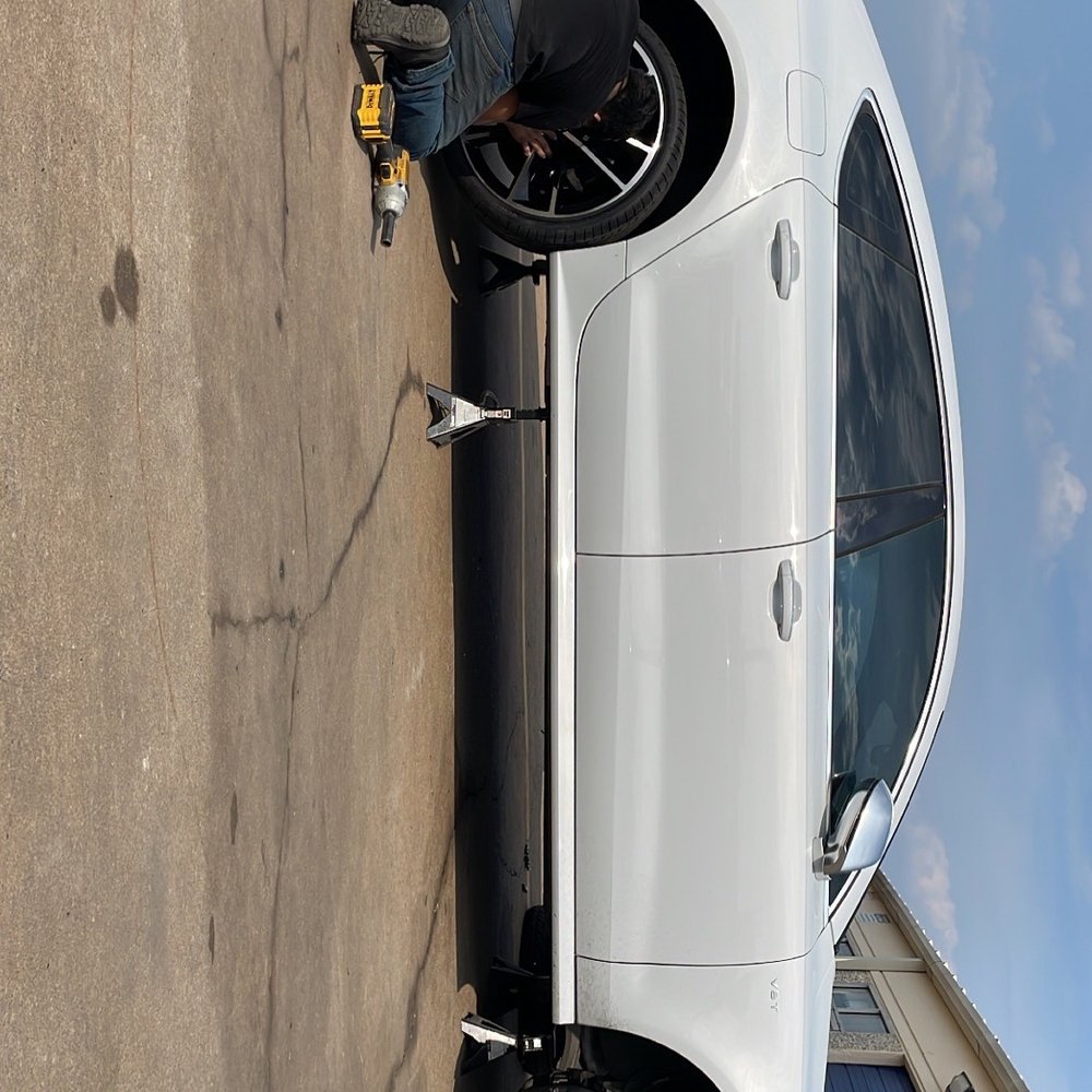Wheels being fitted back after repair Wheels being fitted back after repair