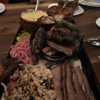Jack Stack Barbecue - Lenexa - Ribs, wings, Beef Brisket (Sliced), Pulled Pork platter. - Barbeque Near Me - Lenexa, Kansas