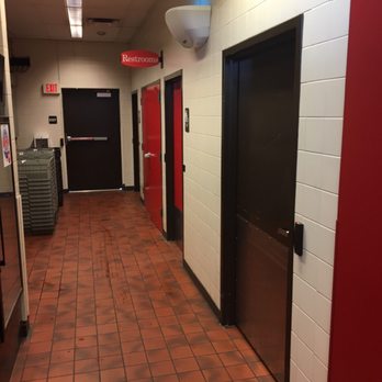 QuikTrip - a hallway with red and black doors - Gas Stations Near Me - Tulsa, Oklahoma