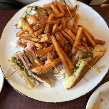 Bistro 217 - Club (sans one quarter which had already been enjoyed) and sweet potato fries. - Seafood Near Me - Pawleys Island, South Carolina Bistro 217 - Club (sans one quarter which had already been enjoyed) and sweet potato fries. - Seafood Near Me - Pawleys Island, South Carolina