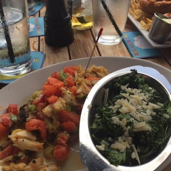 Sundowners - Yellowtail Fernando with a side of Sautéed Kale and Spinach - Seafood Near Me - Key Largo, Florida Sundowners - Yellowtail Fernando with a side of Sautéed Kale and Spinach - Seafood Near Me - Key Largo, Florida