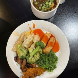 a bowl of soup and a plate of food a bowl of soup and a plate of food
